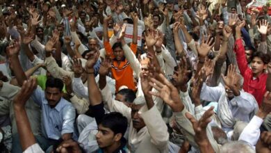 West Pakistani Hindu refugees shout slogans as they take part in a Human Rights demonstration near Parliament House in New Delhi, 18 May 2006. Hundreds of protesters demanded that the Indian government provide them with housing, land, government jobs and free education. AFP PHOTO/RAVEENDRAN (Photo by RAVEENDRAN / AFP)