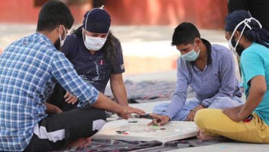 In this file photo, inmates wearing protective masks play carrom inside a jail during the nationwide lokcdown to curb the spread of coronavirus, in Jammu. (PTI)