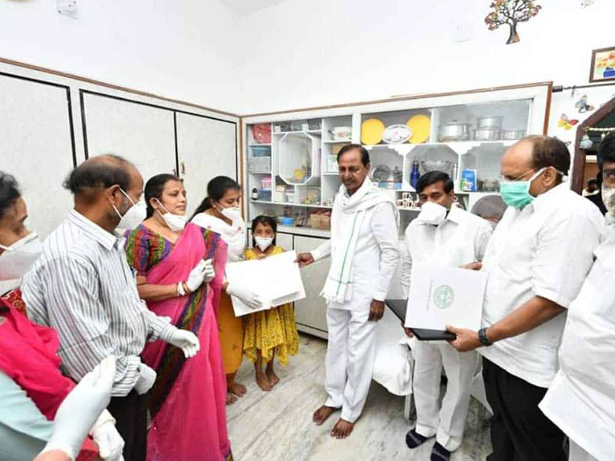Telangana CM hands over cheques, job letter to martyred Colonel's kin