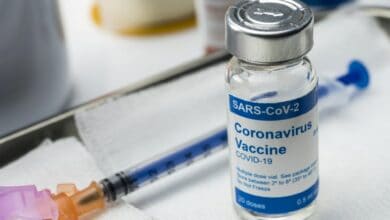 Coronavirus covid-19 experimental vaccine in a laboratory, conceptual image