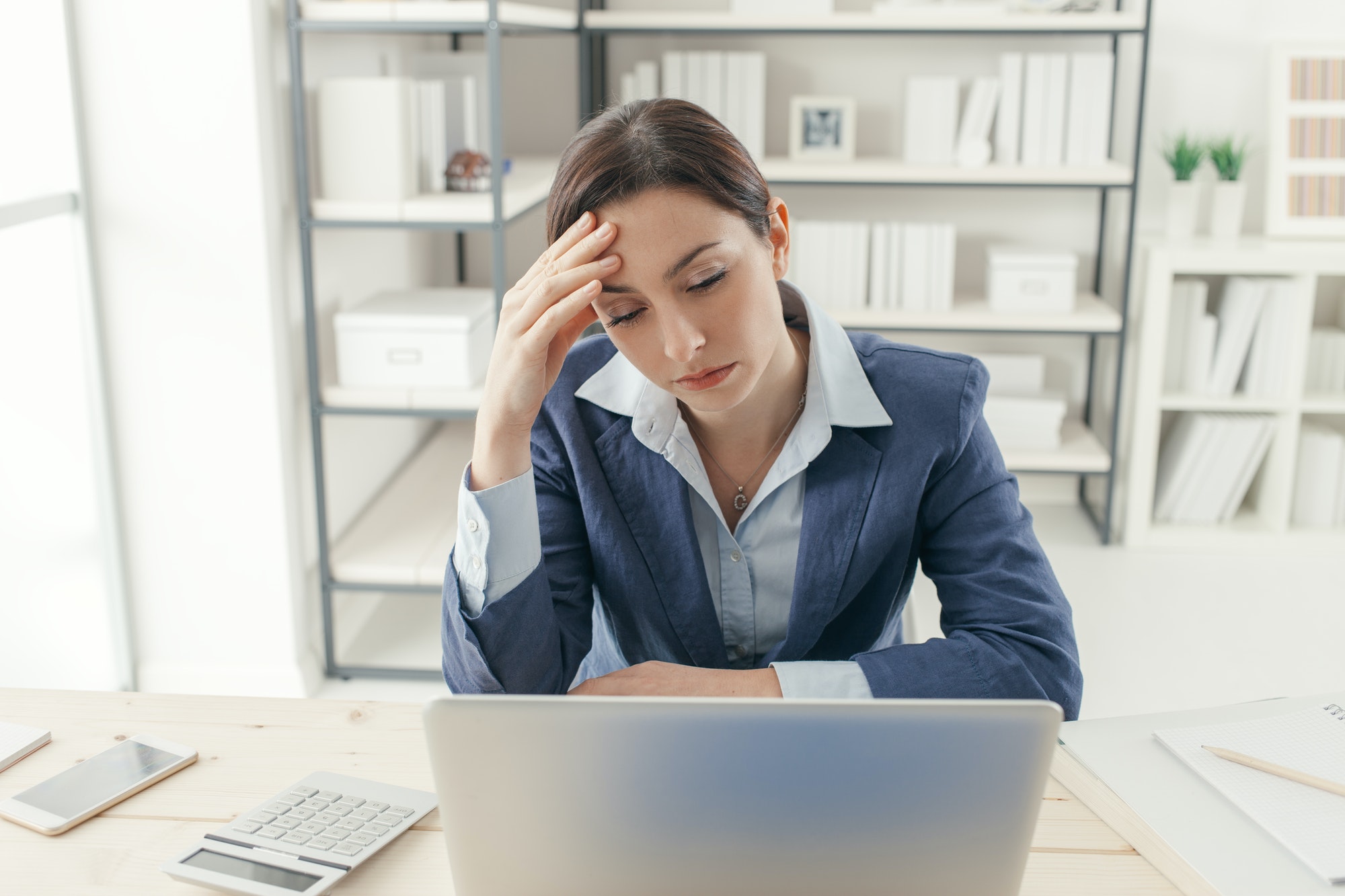Exhausted businesswoman in the office