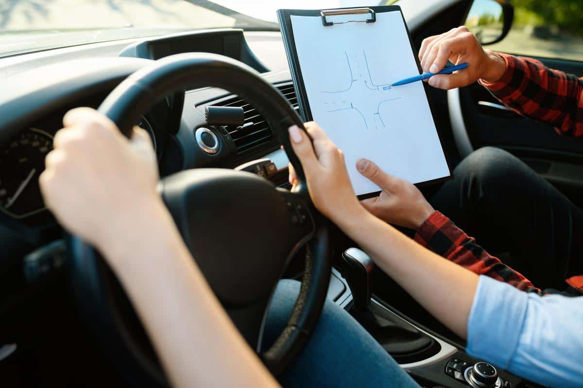 Woman and man with checklist, driving school