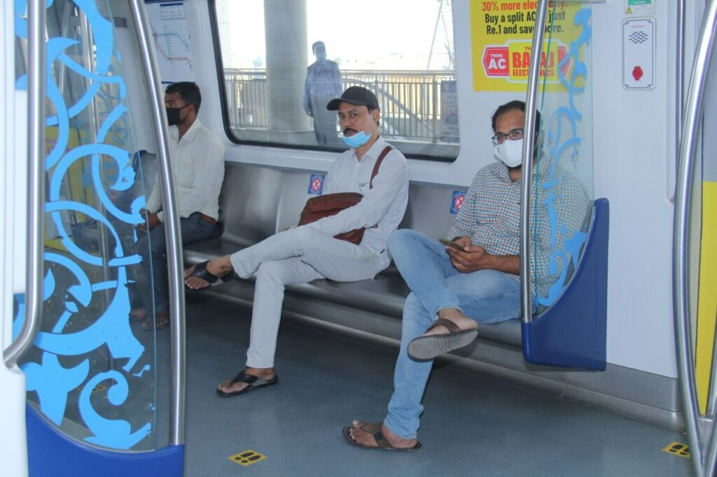 Passengers travelling in Hyderabad Metro Rail 