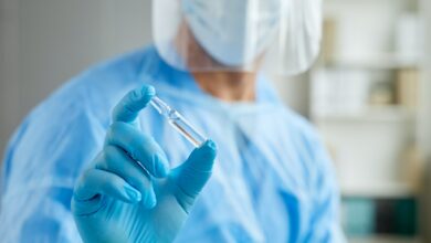 Unrecognizable Doctor With Vaccine