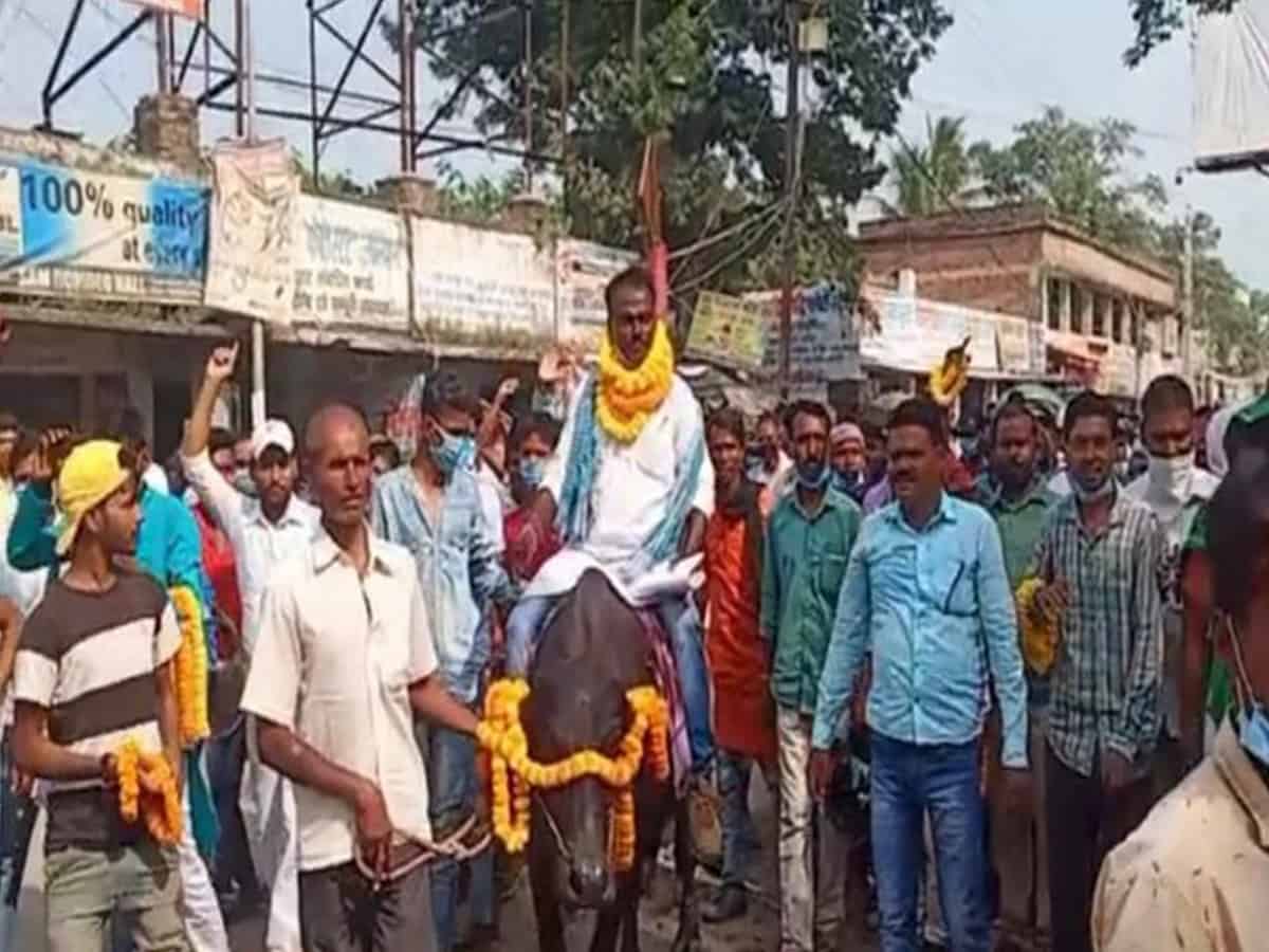Independent candidate from Bihar's comes to file nomination on a buffalo