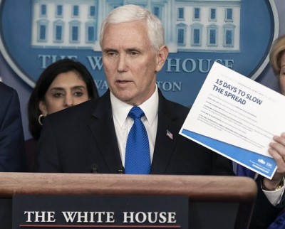 Pence stays campaigning despite aide's Covid-19 diagnosis