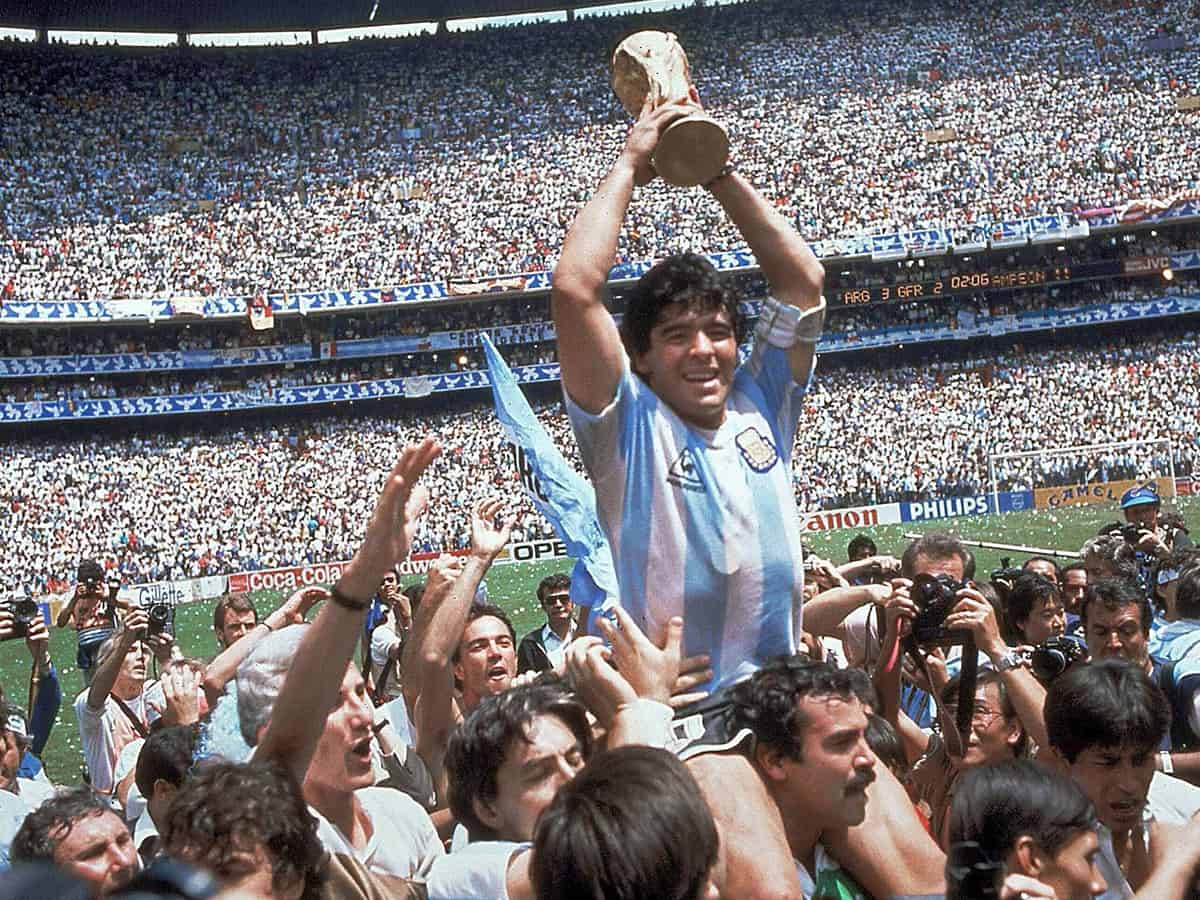 exico City: FILE - In this June 29, 1986 file photo, Diego Maradona holds up his teams trophy after Argentinas 3-2 victory over West Germany at the World Cup final soccer match at Atzeca Stadium in Mexico City. The Argentine soccer great who was among the best players ever and who led his country to the 1986 World Cup title before later struggling with cocaine use and obesity, has died. He was 60. AP/PTI