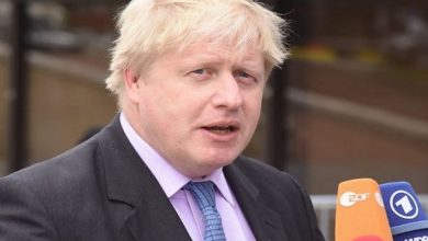 Boris Johnson defends virus record after ex-aide's attack