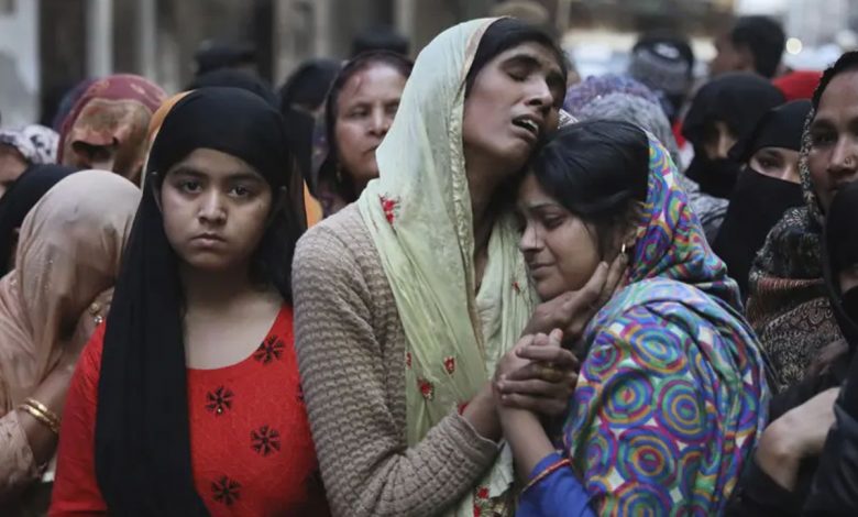 Relatives mourn Mohammad Mudasir, 31, who was killed in rioting in Delhi. Photograph: Manish Swarup/AP
