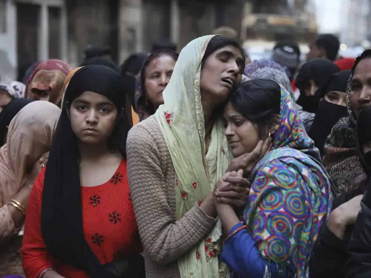 Relatives mourn Mohammad Mudasir, 31, who was killed in rioting in Delhi. Photograph: Manish Swarup/AP