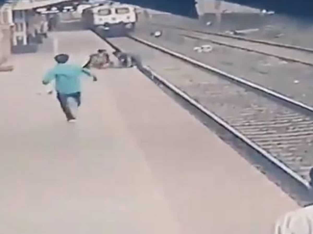 Man 'out-races' speeding train to save kid
