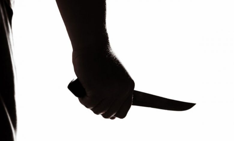 Representational image of man holding a knife.