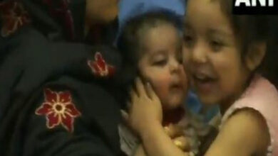 Watch: Young girl kisses infant with joy after reaching India from Kabul