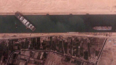 Vessel runs aground, briefly blocking part of Suez Canal