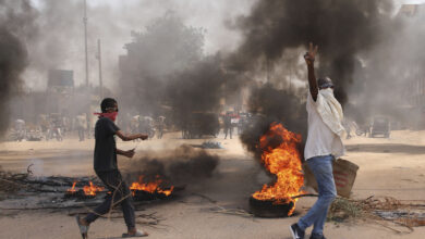 Protesters in Sudan burn tires, block roads a day after coup