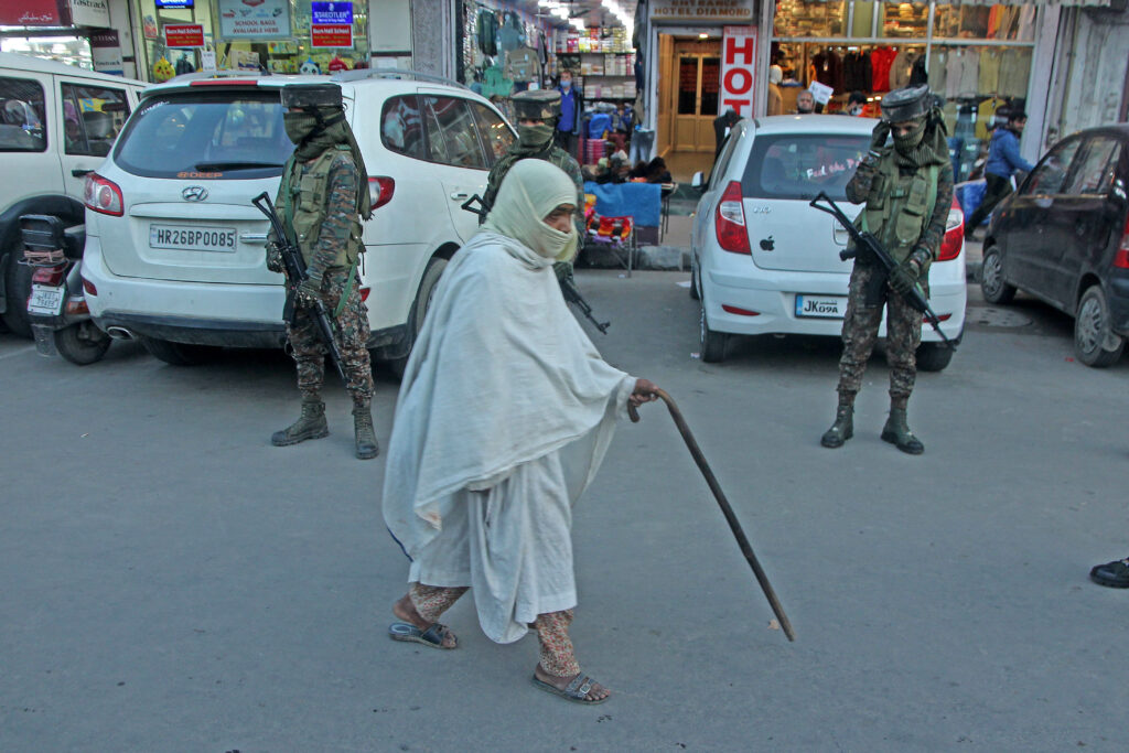 Female security forces stand guard during frisking of pedestrains at Lal Chowk Srinagar