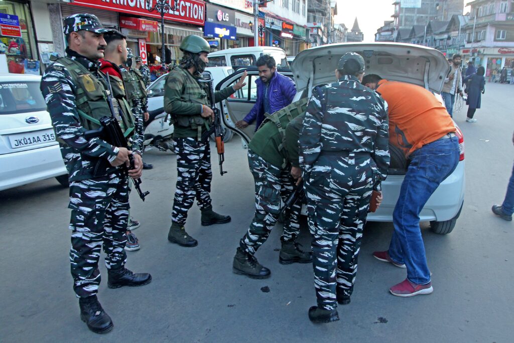 Indian Security forces checking vehicles at City Central Lal Chowk Srinagar, Security forces intensify frisking in srinagar after recent civilian killings in the valley