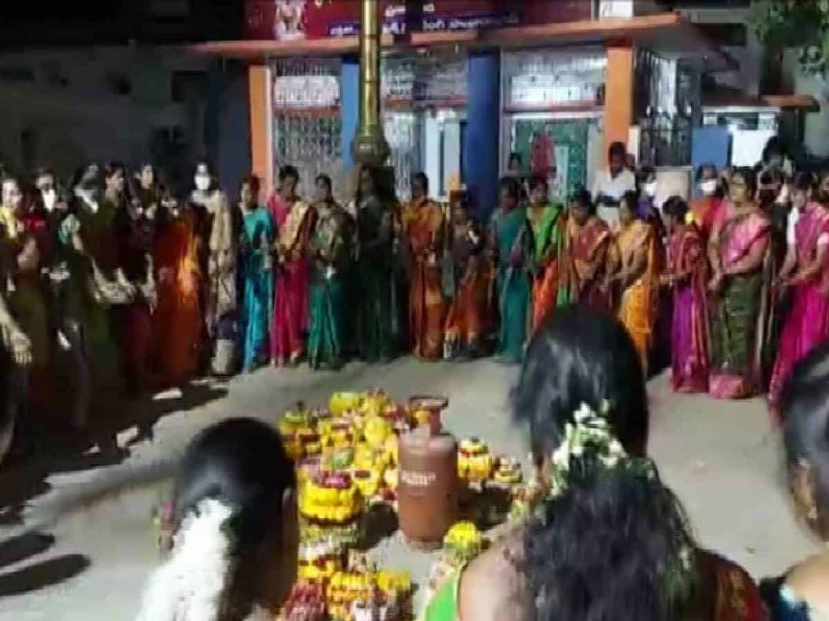 Women celebrating 'Bathukamma' festival and stage protest against LPG price hike