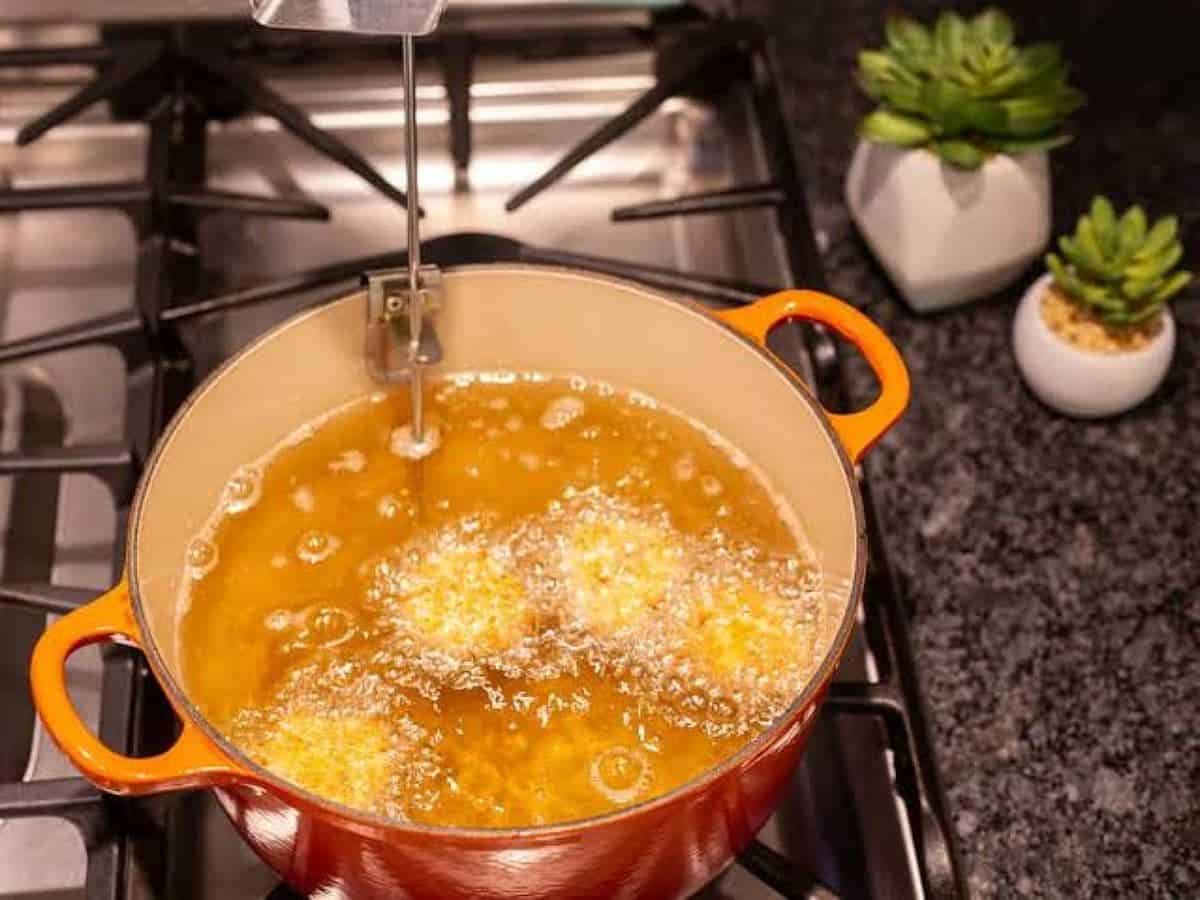 Man puts wife's face in boiling oil over frying potatoes