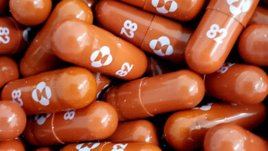 UK regulators approve world's first pill to treat COVID-19