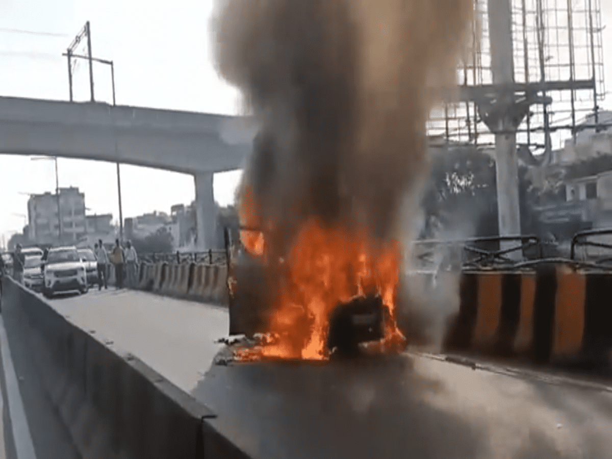 Moving car catches fire on flyover in Secunderabad parade ground