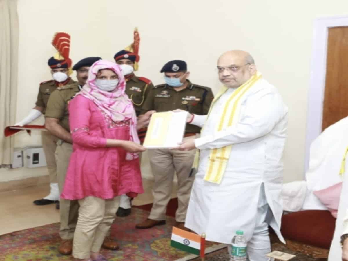 Shah hands over appointment letters to kin of martyred J&K cops