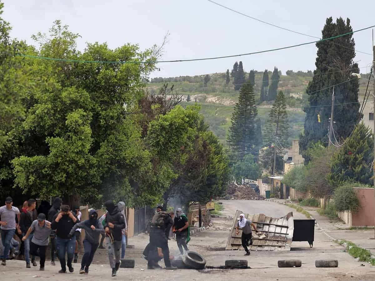 Dozens of Palestinians injured as Israeli settlers march in West Bank