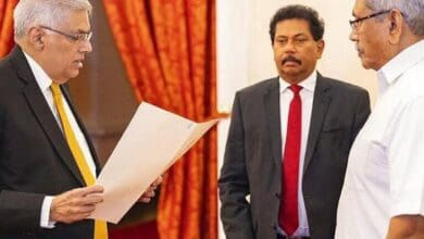 Sri Lankan President's Office, President Gotabaya Rajapaksa, right, watches Ranil Wickremesinghe take the oath of office as the new prime minister in Colombo, Sri Lanka