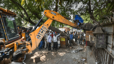 New Delhi: A bulldozer razes an illegal structure during an anti-encroachment drive by the MCD at the New Friends Colony, in New Delhi, Tuesday, May 10, 2022. (PTI Photo/Arun Sharma) (PTI05_10_2022_000026B)