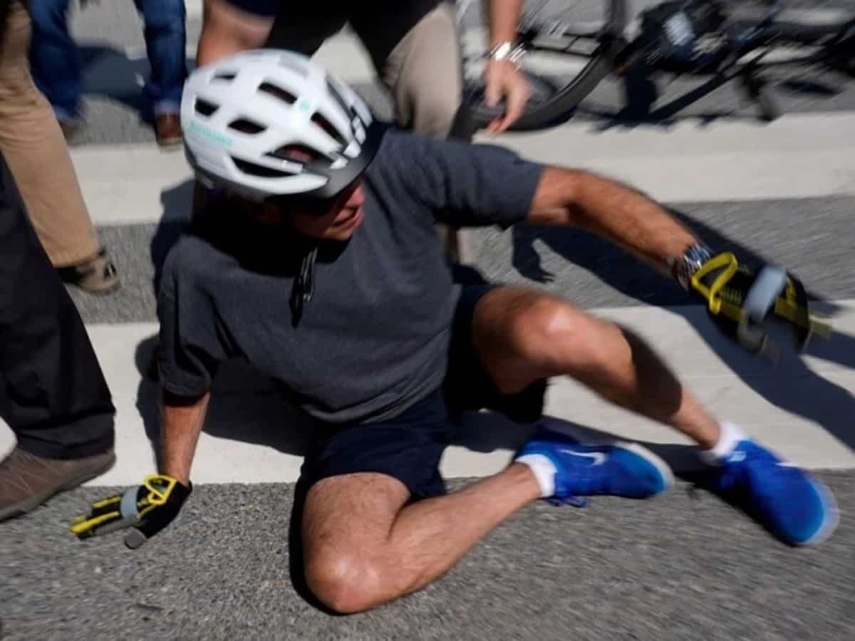 US President Joe Biden falls off while riding his bicycle