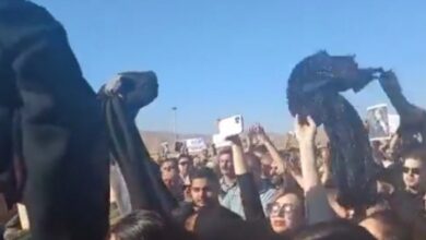 Watch: Iranian women remove headscarves in protest at Mahsa Amini's funeral