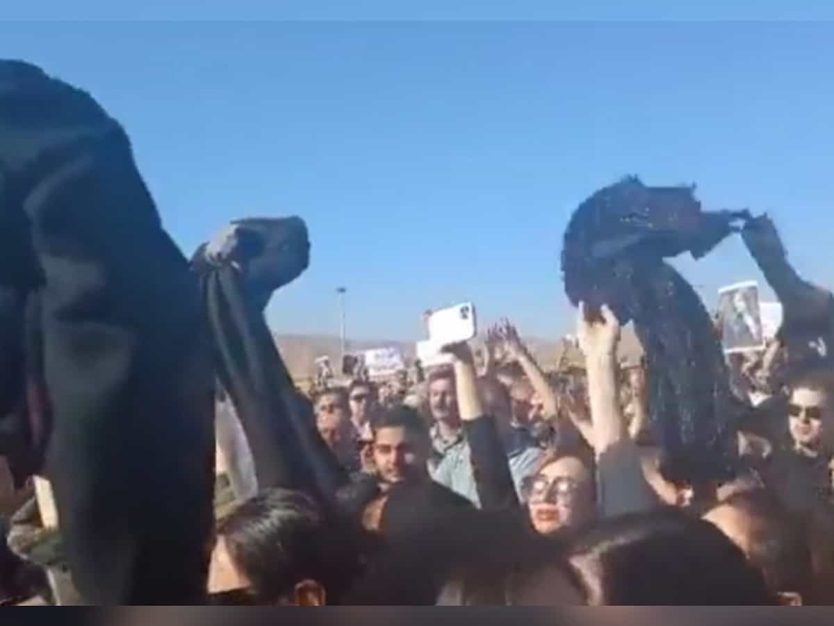 Watch: Iranian women remove headscarves in protest at Mahsa Amini's funeral