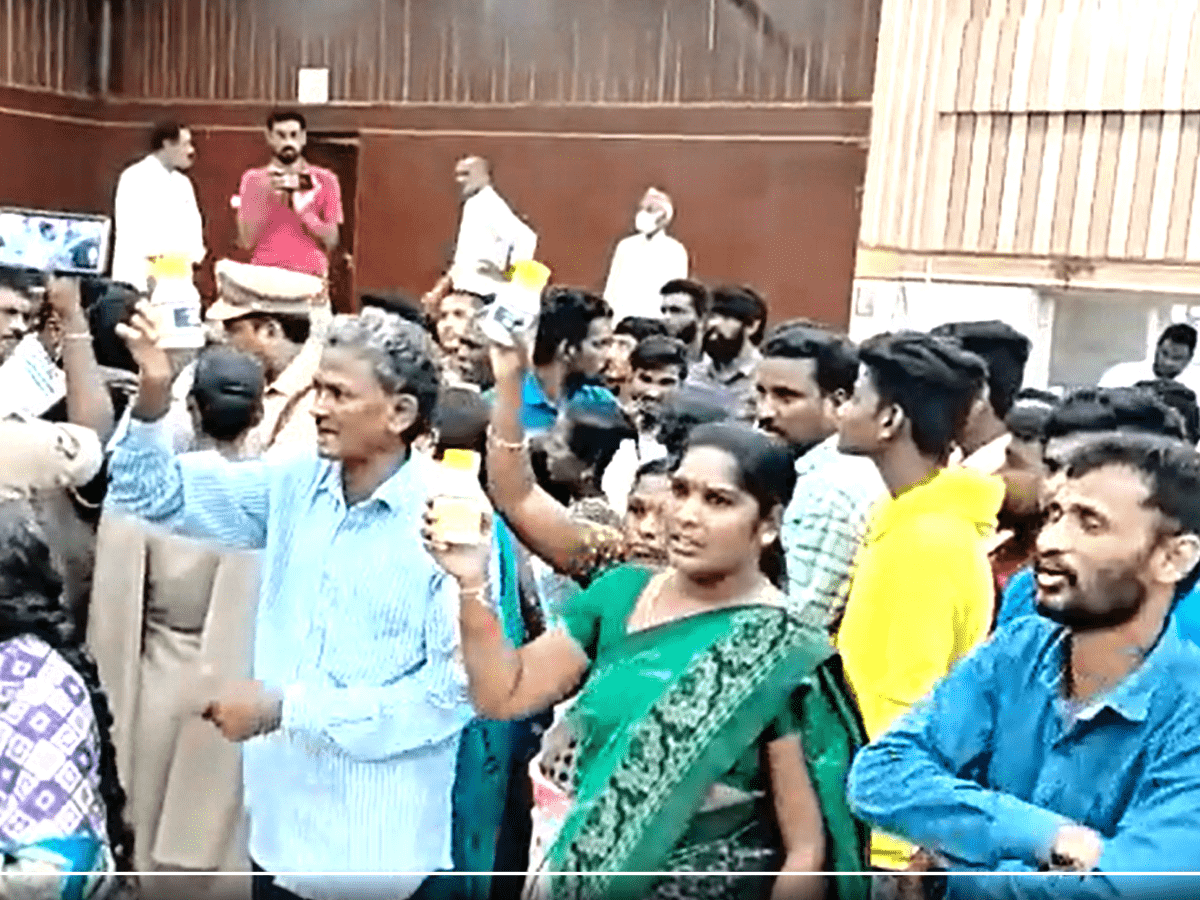 protestors carried pesticide bottles and threatened to commit suicide