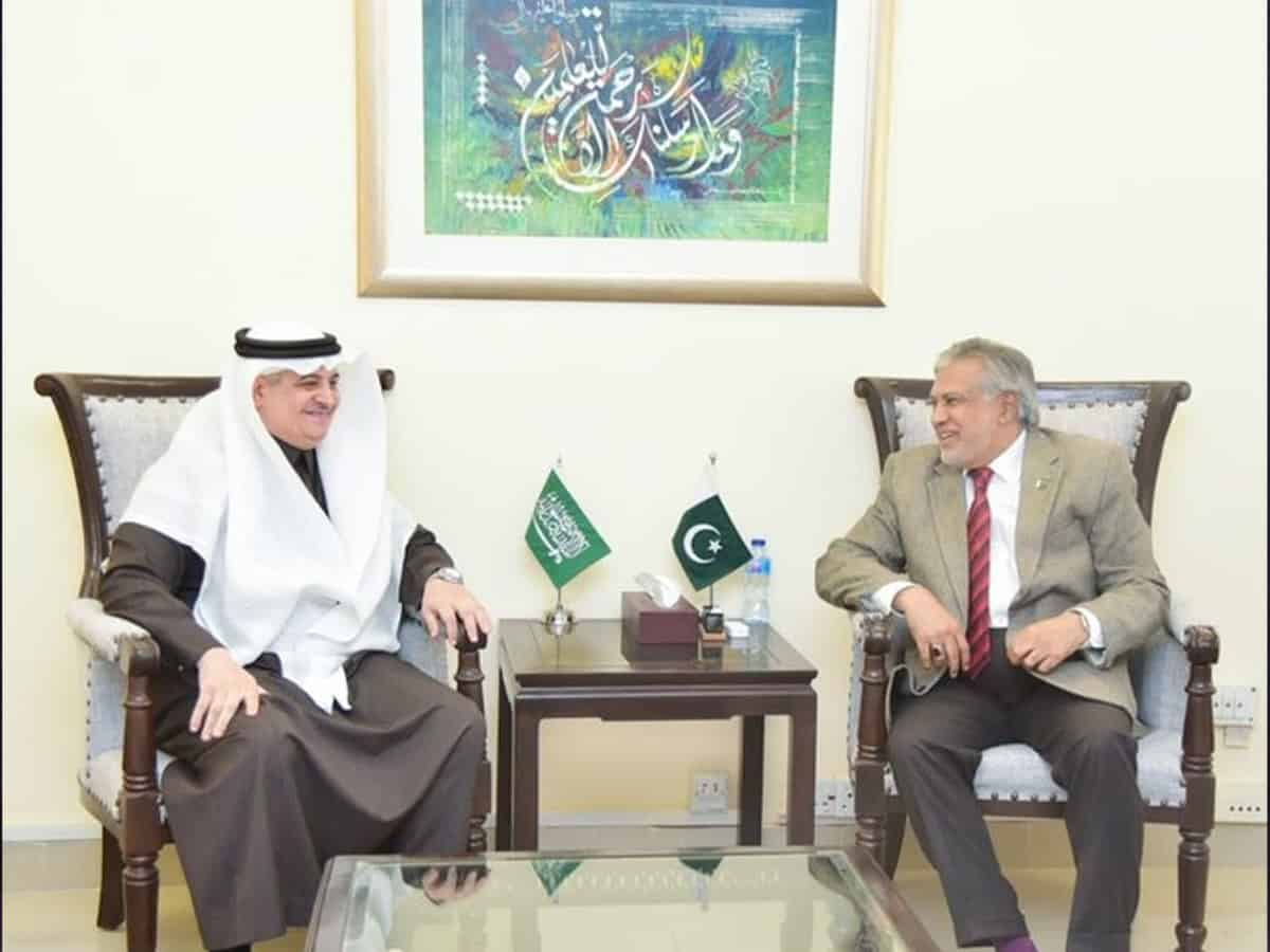 Finance Minister Ishaq Dar with Nawaf bin Said Al-Malki, the Saudi ambassador.