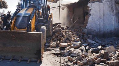 A house being demolished in Kashmir