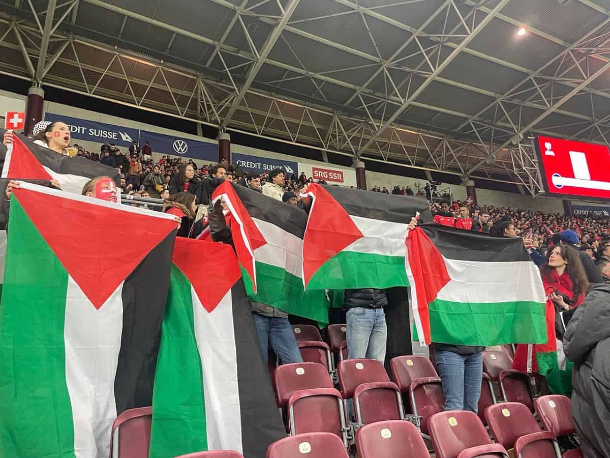 Swiss football fans raise flag of Palestine in match against Israeli team