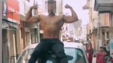 Youth held for going shirtless and doing stunts on car