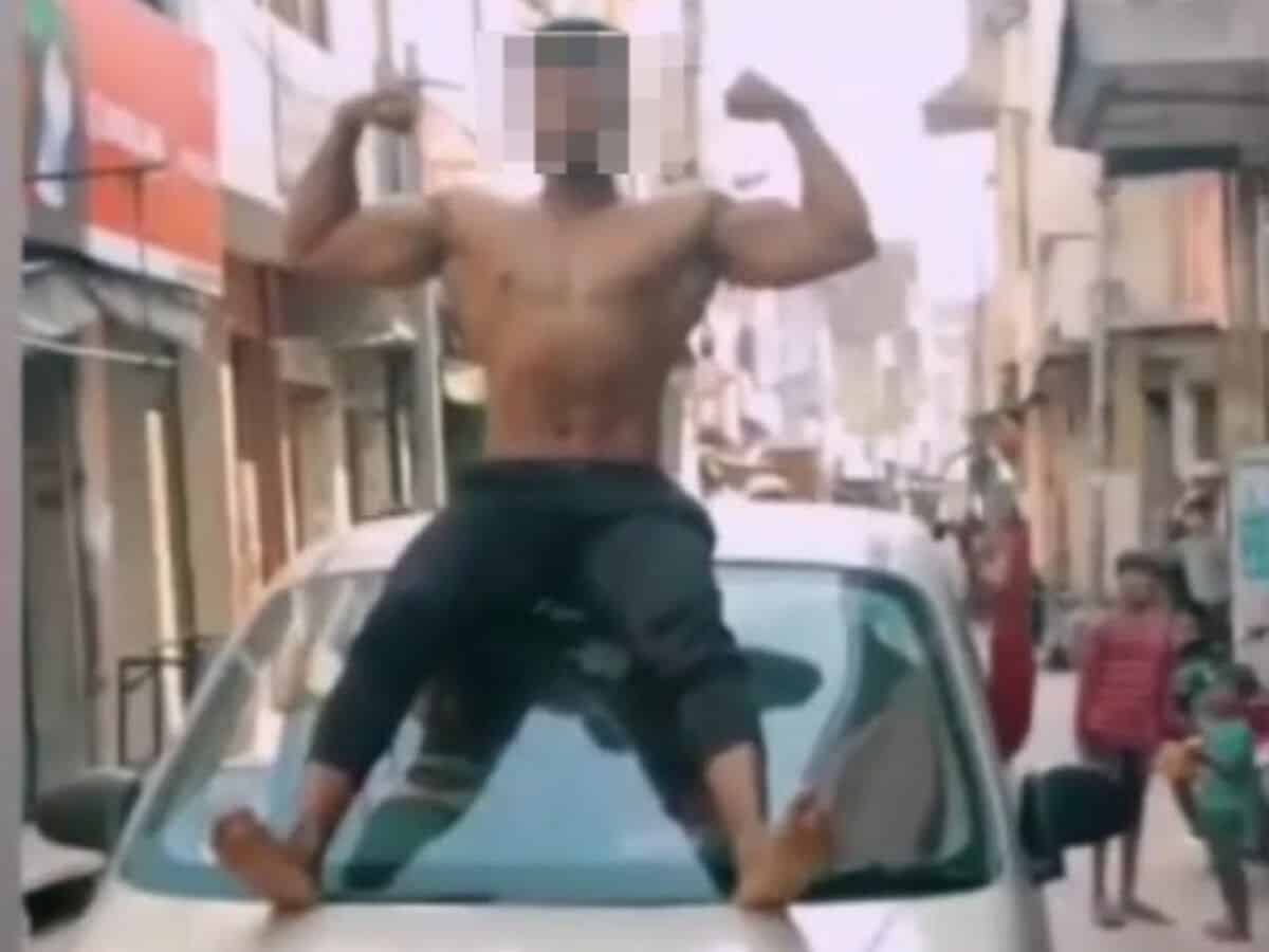 Youth held for going shirtless and doing stunts on car