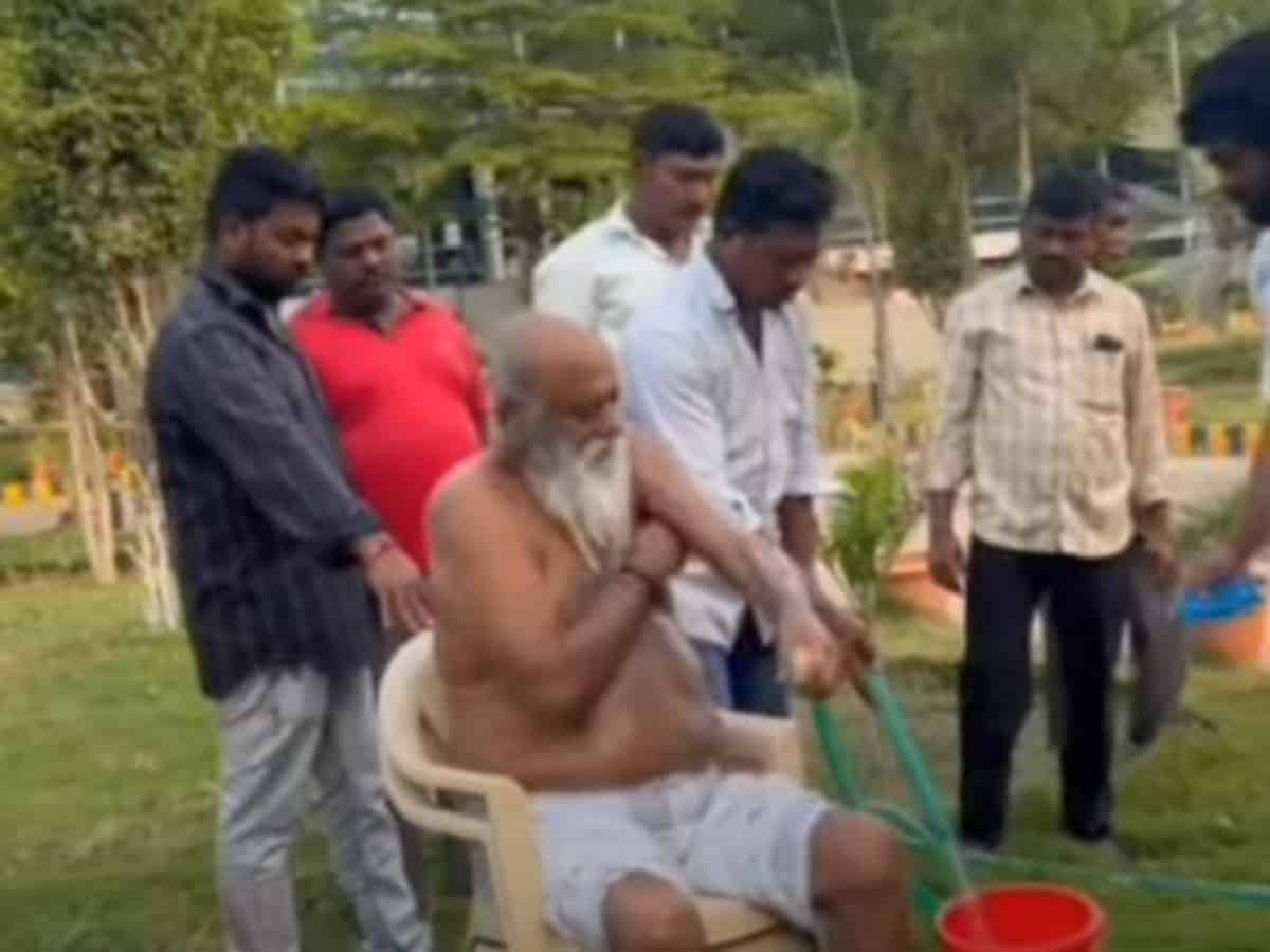 Andhra municipal chairman takes bath in front of office