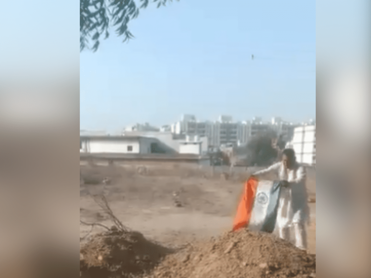 tricolour on the grave of gangster-politician Atiq Ahmad