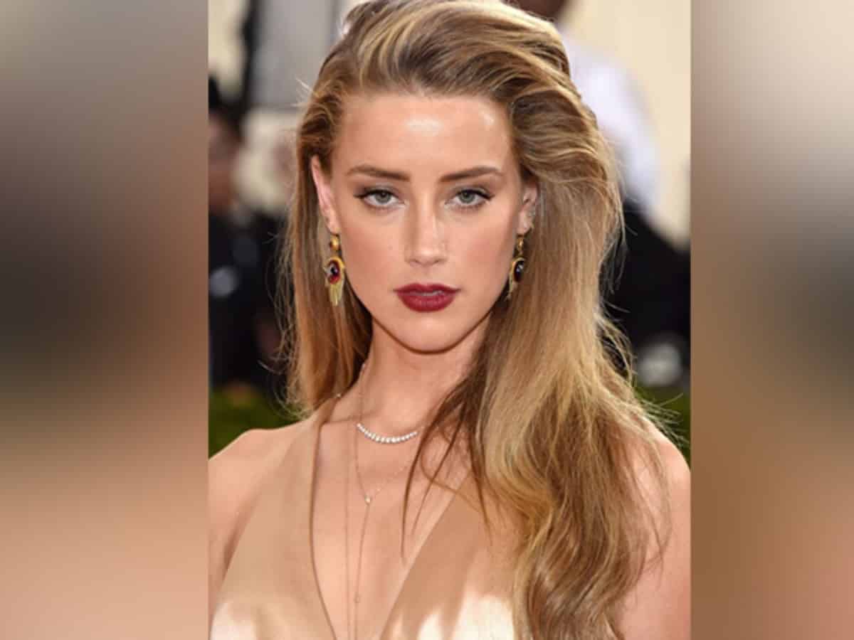 Amber Heard moved to Madrid?