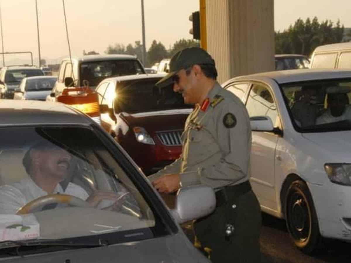 The photo shows Saudi traffic