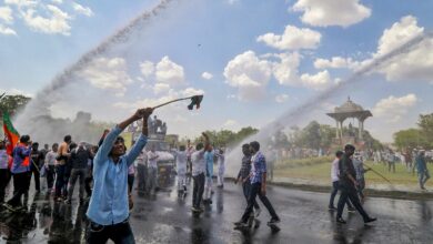 Jaipur: Police use water cannons to disperse the BJP supporters during their protest against the Rajasthan government, at Statue Circle near Secretariat office in Jaipur, Tuesday, June 13, 2023. (PTI Photo) (PTI06_13_2023_000207B)