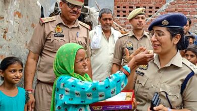 SP Bulandshahr Anukriti Sharma with an elderly woman Noorjahan after the former got electricity connection installed at the latter’s house, in Bulandshahr,