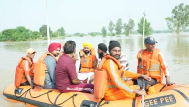 Riding boat, Punjab CM visits flood-hit areas