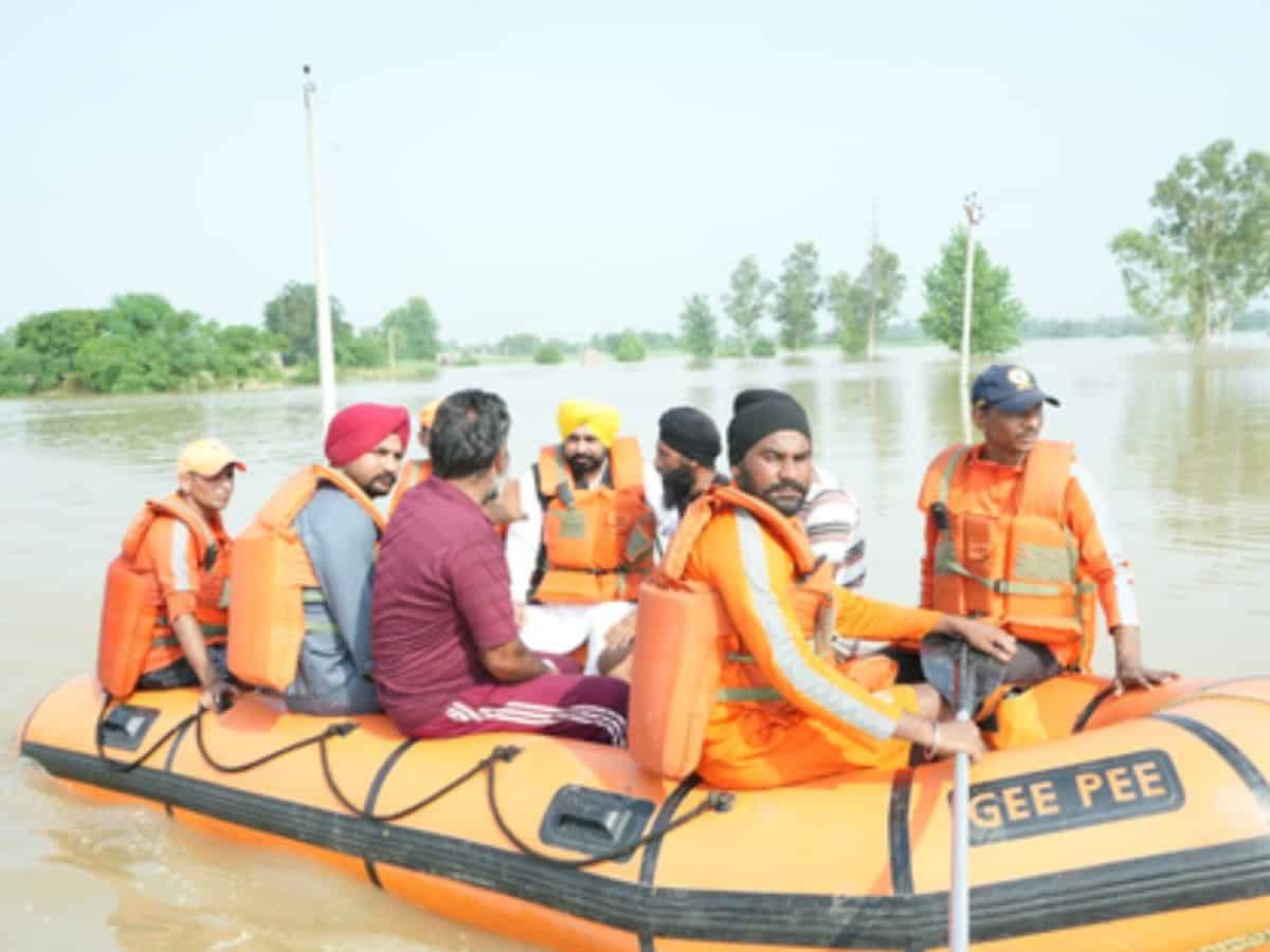 Riding boat, Punjab CM visits flood-hit areas