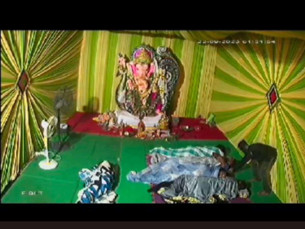 Watch: Man steals mobile from people sleeping inside Ganesh pandal