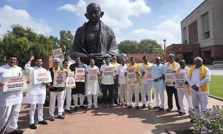 Telugu Desam Party (TDP) MPs with former Andhra Pradesh CM N Chandrababu Naidu’s son Nara Lokesh stage a protest at Mahatma Gandhi statue over Naidu's arrest