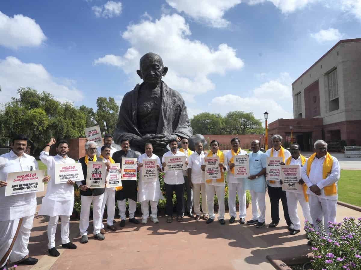 Telugu Desam Party (TDP) MPs with former Andhra Pradesh CM N Chandrababu Naidu’s son Nara Lokesh stage a protest at Mahatma Gandhi statue over Naidu's arrest