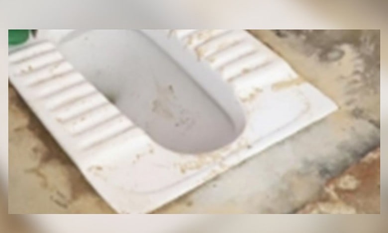 Forced to clean school toilet